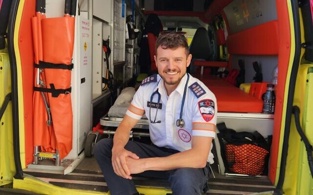 Yarin Shitrit with an MDA ambulance. Photo: Yarin Shitrit. Yarin Shitrit with an MDA ambulance. Photo: Yarin Shitrit.