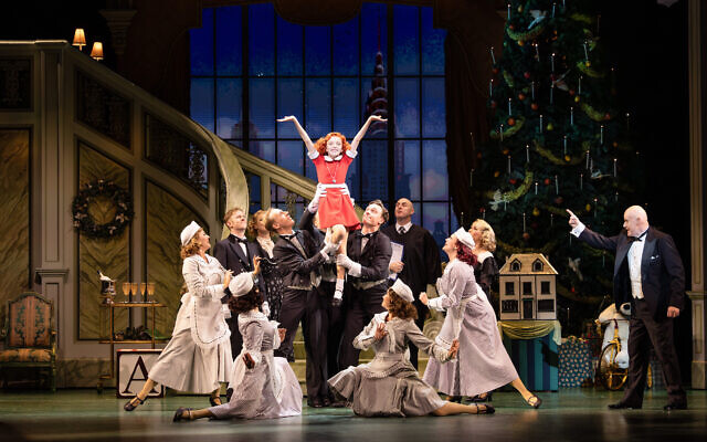 A scene from the musical Annie starring Anthony Warlow (right) as businessman Oliver “Daddy” Warbucks. Photo: Daniel Boud A scene from the musical Annie starring Anthony Warlow (right) as businessman Oliver “Daddy” Warbucks. Photo: Daniel Boud