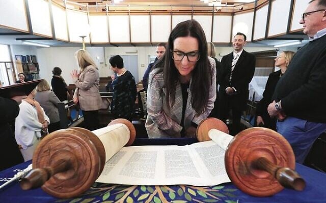 Bayside councillors and executives at the Brighton Hebrew Congregation examine a Sefer Torah. Photo: Peter Haskin. Bayside councillors and executives at the Brighton Hebrew Congregation examine a Sefer Torah. Photo: Peter Haskin.