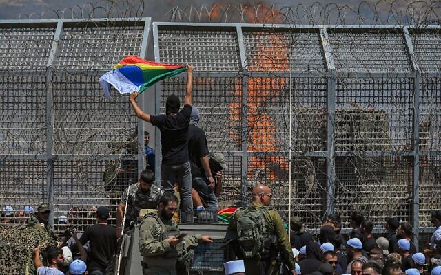 Druze residents protest near the Israeli-Syrian border fence in solidarity with their community in Syria, in Majdal Shams, July 16, 2025. (Michael Giladi/Flash90) Druze residents protest near the Israeli-Syrian border fence in solidarity with their community in Syria, in Majdal Shams, July 16, 2025. (Michael Giladi/Flash90)
