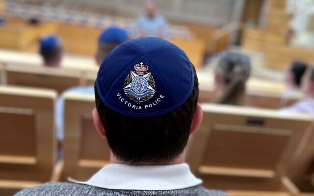 A Victoria Police officer in a synagogue as part of the Jewish cultural awareness program. Photo: CSG. A Victoria Police officer in a synagogue as part of the Jewish cultural awareness program. Photo: CSG.
