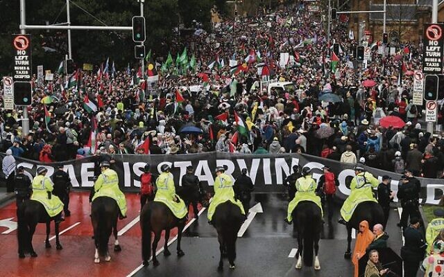Mounted police keep watch as anti-Israel protesters march towards Sydney's Harbour Bridge on Sunday. Photo: Saeed Khan/AFP Mounted police keep watch as anti-Israel protesters march towards Sydney's Harbour Bridge on Sunday. Photo: Saeed Khan/AFP