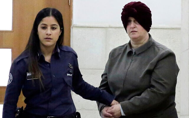 Malka Leifer, right, is brought to a courtroom in Jerusalem, on February 27, 2018. (AP Photo/Mahmoud Illean, File) Malka Leifer, right, is brought to a courtroom in Jerusalem, on February 27, 2018. (AP Photo/Mahmoud Illean, File)