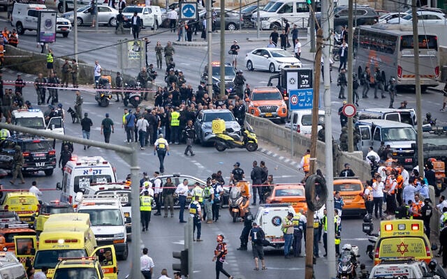 Police and rescue personnel at the scene of a terror attack at Ramot Junction near the entrance to Jerusalem, September 8, 2025 (Chaim Goldberg/FLASH90) Police and rescue personnel at the scene of a terror attack at Ramot Junction near the entrance to Jerusalem, September 8, 2025 (Chaim Goldberg/FLASH90)