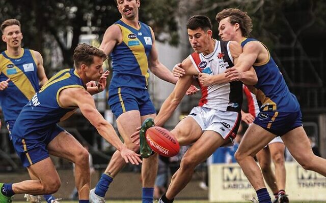 Jackas youngster Jonty Israel kicks in heavy traffic in the men's Premier C decider last Sunday. Photos: Yaakov Frenkel Jackas youngster Jonty Israel kicks in heavy traffic in the men's Premier C decider last Sunday. Photos: Yaakov Frenkel