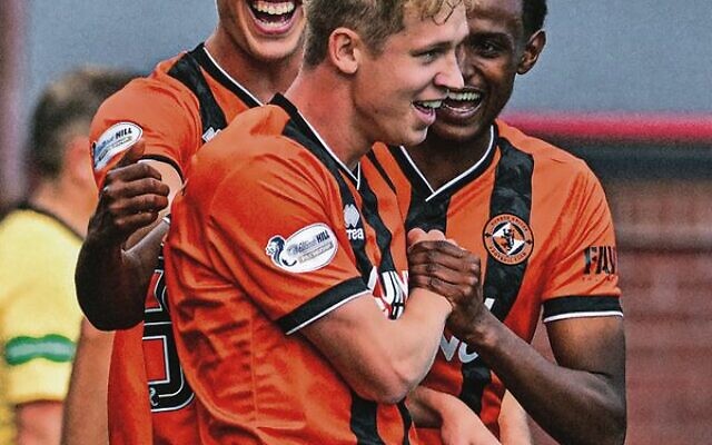 Zac Sapsford celebrates with teammates after scoring for Dundee United in their 2-0 away win against arch rivals Dundee FC on August 31 at Dens Park Stadium. Zac Sapsford celebrates with teammates after scoring for Dundee United in their 2-0 away win against arch rivals Dundee FC on August 31 at Dens Park Stadium.