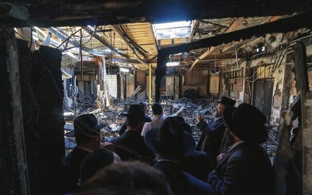 Prime Minister Anthony Albanese and members of the Jewish community visit the torched Adass Israel synagogue. Photo: Dept of PM and Cabinet/AFP Prime Minister Anthony Albanese and members of the Jewish community visit the torched Adass Israel synagogue. Photo: Dept of PM and Cabinet/AFP