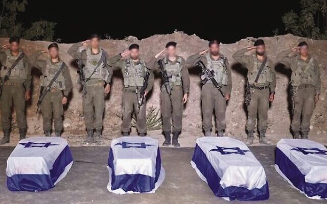 IDF troops salute over the caskets containing the bodies of slain hostages Guy Illouz, Bipin Joshi, Yossi Sharabi and Cpt. Daniel Perez. Photo: IDF IDF troops salute over the caskets containing the bodies of slain hostages Guy Illouz, Bipin Joshi, Yossi Sharabi and Cpt. Daniel Perez. Photo: IDF