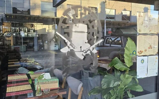 The graffiti stencil used Ned Kelly in front of a Nazi Black Sun symbol. Photo Facebook. The graffiti stencil used Ned Kelly in front of a Nazi Black Sun symbol. Photo Facebook.