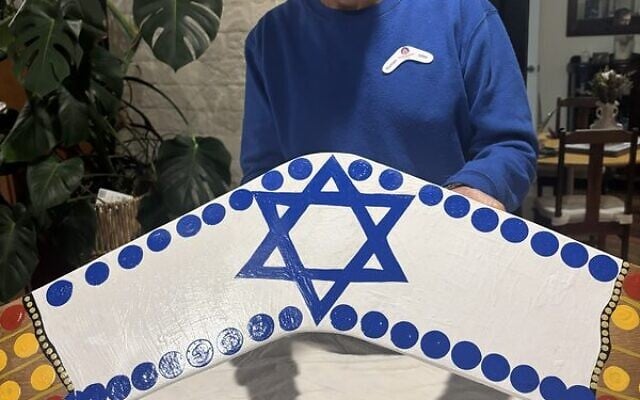 Norman Miller with the boomerang. Norman Miller with the boomerang.
