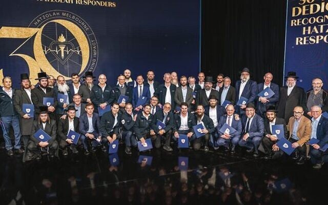 Some of Hatzolah's responders past and present with their awards at the
30th anniversary gala dinner. Photo: Supplied. Some of Hatzolah's responders past and present with their awards at the
30th anniversary gala dinner. Photo: Supplied.