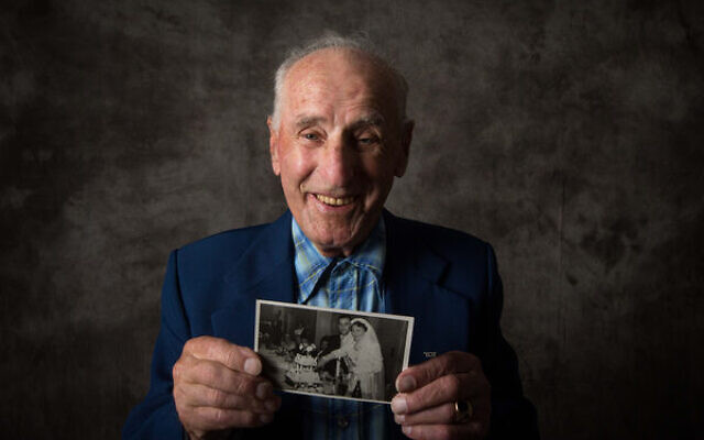 Holocaust Jack Meister holding a photo from his wedding to his wife Nita. Holocaust Jack Meister holding a photo from his wedding to his wife Nita.