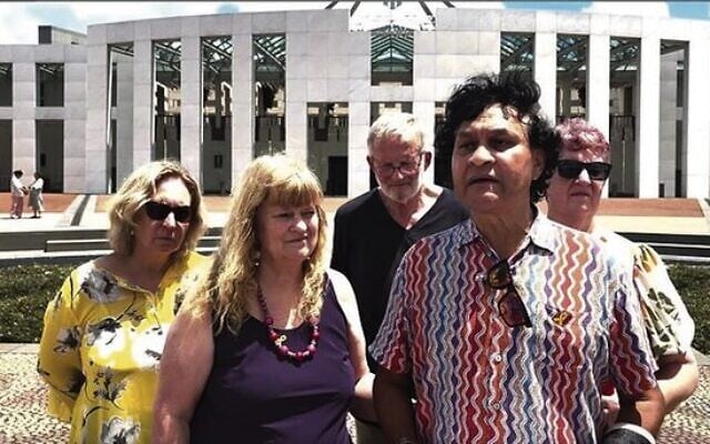 Barbara (front, left) and Norman (right) Miller outside Parliament House in Canberra on December 6. Barbara (front, left) and Norman (right) Miller outside Parliament House in Canberra on December 6.