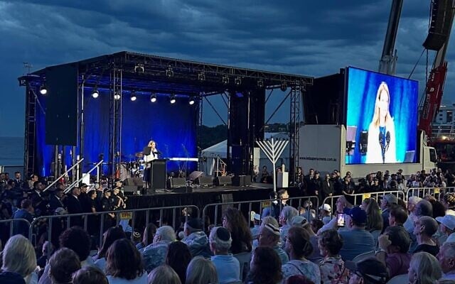 Kellie Sloane addressing the Light Over Darkness vigil at Bondi Beach on Sunday December 21. Photo: Facebook Kellie Sloane addressing the Light Over Darkness vigil at Bondi Beach on Sunday December 21. Photo: Facebook