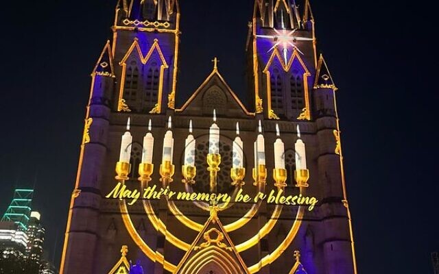 A menorah image projected onto St Mary's Cathedral in Sydney on December 17. A menorah image projected onto St Mary's Cathedral in Sydney on December 17.
