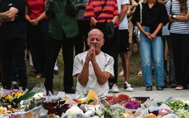 A man prays at the memorial site in Bondi Beach.
Photo: Jewish Board of Deputies A man prays at the memorial site in Bondi Beach.
Photo: Jewish Board of Deputies
