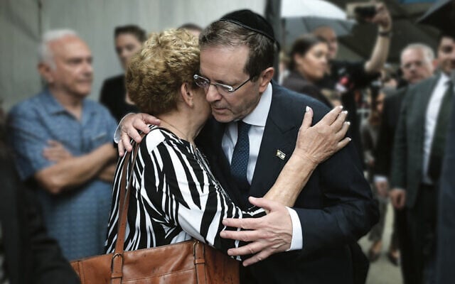President Isaac Herzog embraces Eva Weitzen at Bondi Pavilion on Monday morning. Her husband Tibor was killed during the December 14 terrorist attack. Photo: Social media President Isaac Herzog embraces Eva Weitzen at Bondi Pavilion on Monday morning. Her husband Tibor was killed during the December 14 terrorist attack. Photo: Social media