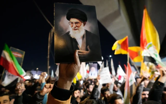 A protester holds a portrait of Iran's Supreme Leader Ayatollah Ali Khamenei during a protest against US and Israeli attacks on multiple cities across Iran at a bridge leading to the fortified Green Zone where the US embassy is located in Baghdad, Iraq, February 28, 2026. (AP Photo/Hadi Mizban) A protester holds a portrait of Iran's Supreme Leader Ayatollah Ali Khamenei during a protest against US and Israeli attacks on multiple cities across Iran at a bridge leading to the fortified Green Zone where the US embassy is located in Baghdad, Iraq, February 28, 2026. (AP Photo/Hadi Mizban)