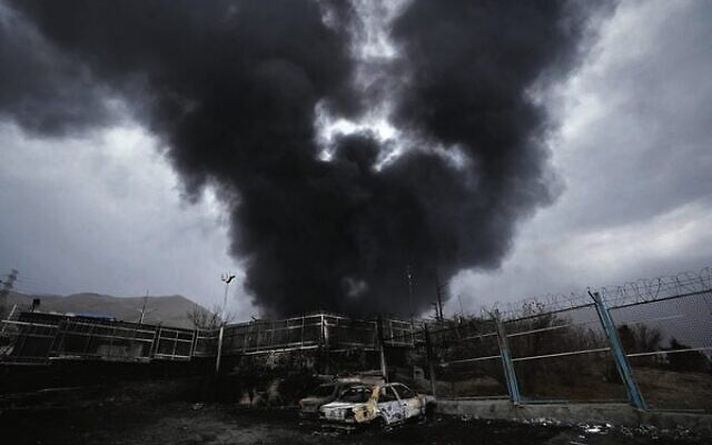 A thick plume of smoke rises from an oil storage facility in Tehran hit by an Israeli strike. Photo: AP Photo/Vahid Salemi A thick plume of smoke rises from an oil storage facility in Tehran hit by an Israeli strike. Photo: AP Photo/Vahid Salemi