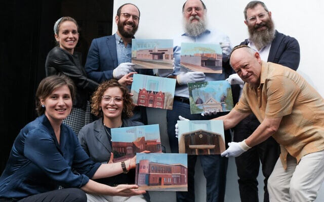 Bottom from, from left: Nina Sanadze, Ilana Razbash
Top row, from left: Rebbetzin Sara & Rabbi Noam Sendor, Rabbi Menachem Wolf, Rabbi Dovid Gutnik, and Michael Krape, holding 7 of 54 paintings from the upcoming exhibition Temple Fragments.
Photo: Emmanuel Santos Bottom from, from left: Nina Sanadze, Ilana Razbash
Top row, from left: Rebbetzin Sara & Rabbi Noam Sendor, Rabbi Menachem Wolf, Rabbi Dovid Gutnik, and Michael Krape, holding 7 of 54 paintings from the upcoming exhibition Temple Fragments.
Photo: Emmanuel Santos