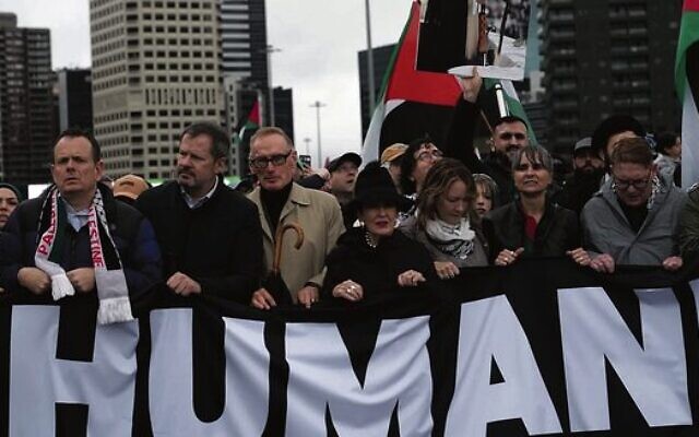 Sydney mayor Clover Moore stands next to former foreign minister Bob Carr under a poster of the Ayatollah at the march over the Sydney Harbour Bridge. Photo: X. Sydney mayor Clover Moore stands next to former foreign minister Bob Carr under a poster of the Ayatollah at the march over the Sydney Harbour Bridge. Photo: X.