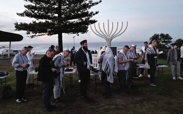 Dawn prayers at Bondi Beach on Tuesday. Photo: Gareth Narunsky Dawn prayers at Bondi Beach on Tuesday. Photo: Gareth Narunsky
