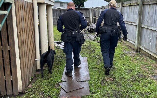 Australian Federal Police executing the search warrant. Photo: AFP. Australian Federal Police executing the search warrant. Photo: AFP.