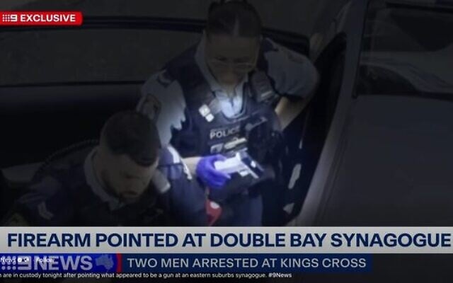 Police with the imitation firearm. Photo: Screenshot/Channel 9 Police with the imitation firearm. Photo: Screenshot/Channel 9