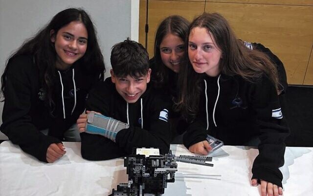 Handasaim High School students show off their robot. Handasaim High School students show off their robot.
