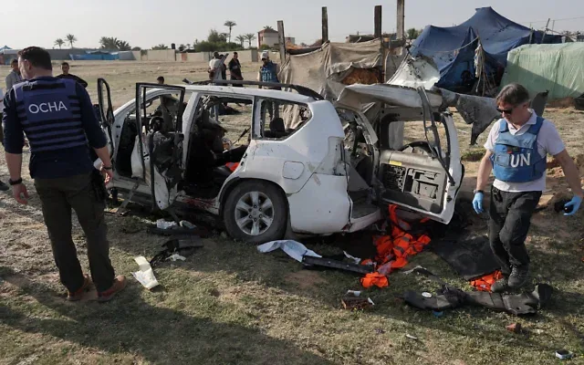United Nations staff members inspect the remains of a car used by US-based aid group World Central Kitchen hit by an Israeli strike the previous day in Deir al-Balah in the central Gaza Strip on April 2, 2024. Photo: AFP/Times of Israel United Nations staff members inspect the remains of a car used by US-based aid group World Central Kitchen hit by an Israeli strike the previous day in Deir al-Balah in the central Gaza Strip on April 2, 2024. Photo: AFP/Times of Israel