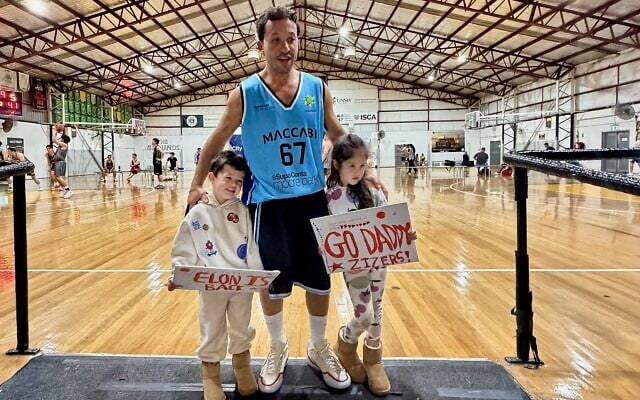 Elon Zizer with his two children last week in his first game for his Maccabi NSW Basketball Club open men's team since being shot in the Bondi Chanukah terror attack. Elon Zizer with his two children last week in his first game for his Maccabi NSW Basketball Club open men's team since being shot in the Bondi Chanukah terror attack.