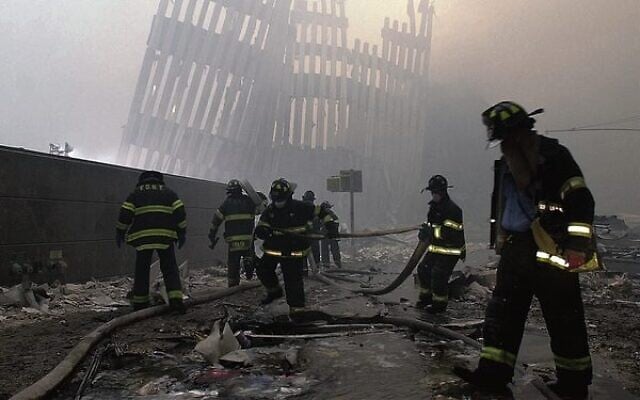 Firefighters work beneath the destroyed vertical struts that once faced the outer walls of the World Trade Centre towers.
Photo: AP Photo/Mark Lennihan, File Firefighters work beneath the destroyed vertical struts that once faced the outer walls of the World Trade Centre towers.
Photo: AP Photo/Mark Lennihan, File