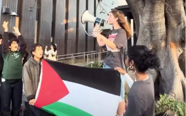 A students activist speaks in a megaphone while others hold a Palestinian flag. Photo: Instagram screenshot A students activist speaks in a megaphone while others hold a Palestinian flag. Photo: Instagram screenshot
