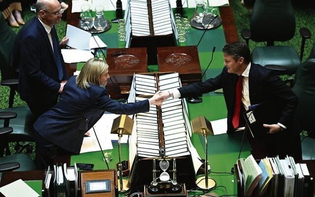 Premier Ben Carroll (right) shakes hands with Opposition Leader Jess Wilson before Question Time in the Legislative Assembly. Photo: AAP Image/James Ross Premier Ben Carroll (right) shakes hands with Opposition Leader Jess Wilson before Question Time in the Legislative Assembly. Photo: AAP Image/James Ross