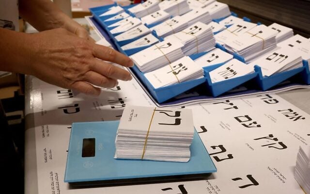 A worker weighs newly printed ballot papers, at a printing factory, ahead of the October 27 Israeli legislative election in Kiryat Gat, southern Israel, on October 8, 2026. Photo: Jack Guez/AFP A worker weighs newly printed ballot papers, at a printing factory, ahead of the October 27 Israeli legislative election in Kiryat Gat, southern Israel, on October 8, 2026. Photo: Jack Guez/AFP