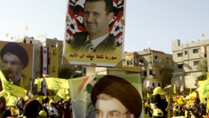 16 أغسطس 2013 زعيم حزب الله حسن نصر الله (القاع) والرئيس السوري بشار الأسد . AFP PHOTO / محمود الزيات