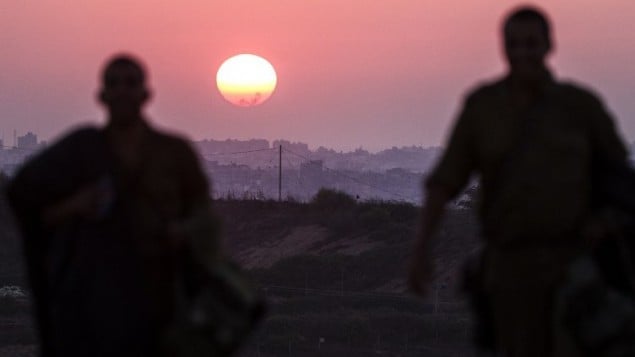صورة مأخوذة من الحدود الاسرائيلية مع قطاع غزة لغروب الشمس 4 أغسطس 2014  AFP PHOTO / JACK GUEZ