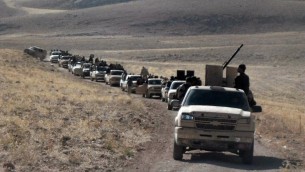 مجموعة من المتمردين عند الجانب السوري من تلال القلمون القريبة من الحدود اللبنانية  22 أيلول، 2014. AFP PHOTO/WISSAM Al -OMOR
