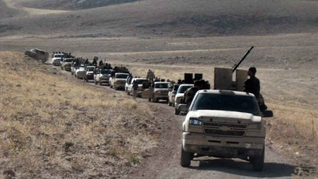 مجموعة من المتمردين عند الجانب السوري من تلال القلمون القريبة من الحدود اللبنانية  22 أيلول، 2014. AFP PHOTO/WISSAM Al -OMOR