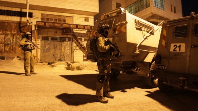 صورة توضيحية: جنود إسرائيليون في الضفة الغربية، 15 يونيو، 2014. (AFP/Hazem Bader) صورة توضيحية: جنود إسرائيليون في الضفة الغربية، 15 يونيو، 2014. (AFP/Hazem Bader)