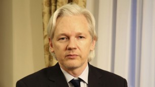 In this July 30, 2013 file photo released by Sunshine Press Productions, WikiLeaks founder Julian Assange sits inside the Ecuadorian Embassy in London. AP/Sunshine Press Productions, File