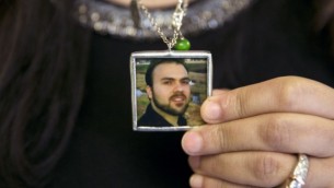 Naghmeh Abedini holds a necklace with a photograph of her husband, Saeed Abedini, on Capitol Hill in Washington, June 2, 2015 (AP Photo/Jacquelyn Martin, File)