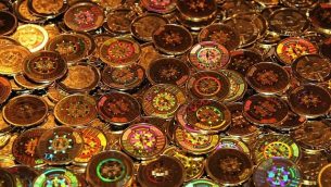 صورة توضيحية لبيتكوين - وهي عملة رقمية معماة. (Courtesy BitsofGold)