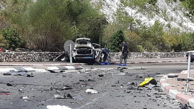 موقع انفجار سيارة في اغتيال اجرامي مشتبه به في نيشر، 3 يونيو 2019 (Israel Police) موقع انفجار سيارة في اغتيال اجرامي مشتبه به في نيشر، 3 يونيو 2019 (Israel Police)