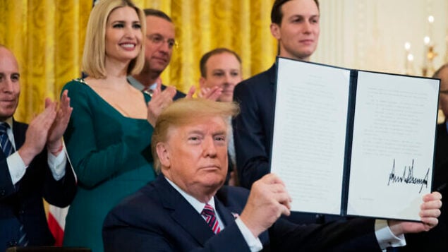 President Donald Trump shows the executive order he signed combatting anti-Semitism in the U. S. during a Hanukkah reception in the East Room of the White House Wednesday, Dec. 11, 2019, in Washington. (AP Photo/Manuel Balce Ceneta) President Donald Trump shows the executive order he signed combatting anti-Semitism in the U. S. during a Hanukkah reception in the East Room of the White House Wednesday, Dec. 11, 2019, in Washington. (AP Photo/Manuel Balce Ceneta)