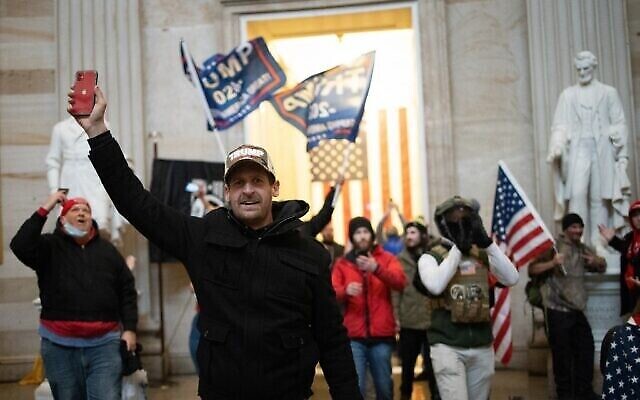 WASHINGTON, DC - JANUARY 06: A pro-Trump mob enters the Roturnda of the U.S. Capitol Building on January 06, 2021 in Washington, DC. Congress held a joint session today to ratify President-elect Joe Biden's 306-232 Electoral College win over President Donald Trump. A group of Republican senators said they would reject the Electoral College votes of several states unless Congress appointed a commission to audit the election results.   Win McNamee/Getty Images/AFP