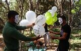Masked Palestinian followers of the Hamas movement near Beit Lahia in the Gaza Strip, prepare to fly incendiary balloons across the northern border toward Israel, on May 8, 2021, a day after al-Quds (Jerusalem) Day. - Israel braced for more protests today after clashes at Jerusalem's flashpoint Al-Aqsa Mosque compound wounded more than 200 people and as the US, EU and regional powers urged calm after days of escalating violence.
The unrest came as Iran and its allies around the world marked Al-Quds Day, an annual show of solidarity with the Palestinians. (Photo by MOHAMMED ABED / AFP)