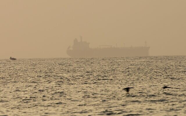The oil tanker Mercer Street, which came under attack last week off Oman, is seen moored off Fujairah, United Arab Emirates, Wednesday, Aug. 4, 2021. The British navy warned of a "potential hijack" of another ship off the coast of the United Arab Emirates in the Gulf of Oman on Tuesday, though the circumstances remain unclear. (AP Photo/Jon Gambrell)