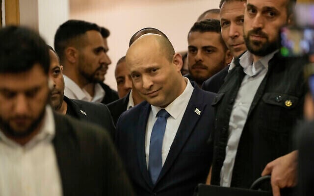 Israeli Prime Minister Naftali Bennett arrives to deliver a statement at the Knesset, Israel's parliament, in Jerusalem, Wednesday, June 29, 2022.  Bennett will not run in upcoming elections, after he led a broad but fragile coalition government that came unraveled barely a year after taking office. (AP Photo/Tsafrir Abayov)