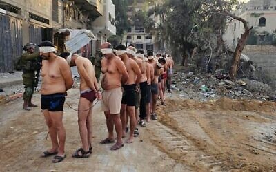 رجال فلسطينيون يستسلمون للقوات في جباليا شمال غزة، في 10 ديسمبر، 2023. (Social media; used in accordance with Clause 27a of the Copyright Law)